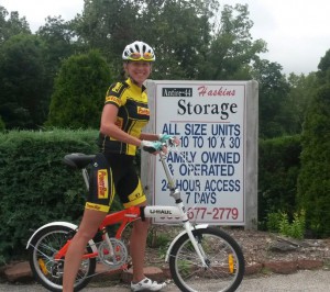 Professional triathlete Sarah Haskins poses on a U-Haul bike outside Antire 44 Haskins Storage and U-Haul Dealership in St. Louis.
