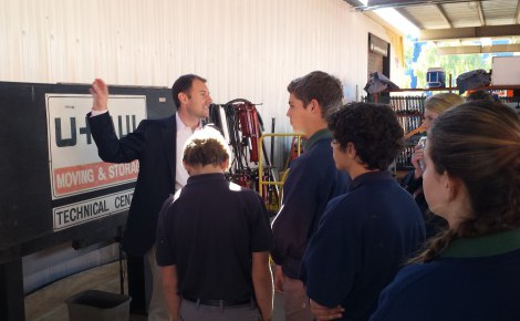 U-Haul Executive VP Stuart Shoen speaks to prep students from two schools during a 2015 tour of the U-Haul Tech Center in Tempe.