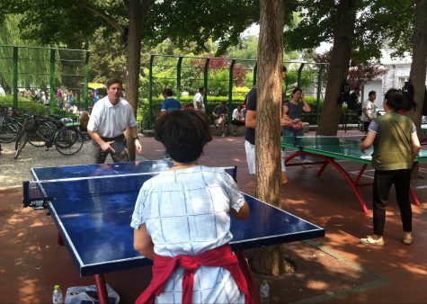 Phoenix Mayor Greg Stanton interacts with the locals over a game of table tennis in Beijing after the Climate Leaders Summit.