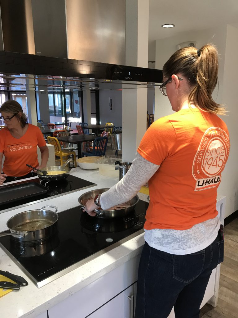 U-Haul Volunteers Cooking at Ronald McDonald House