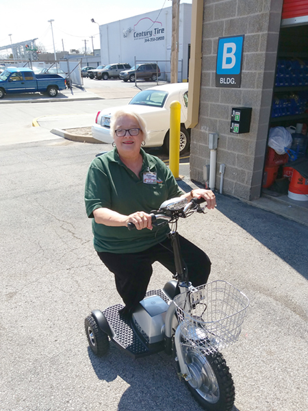 General Manager Cathy Engle on scooter.