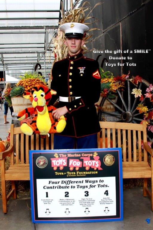 Marine with Tigger and donation sign