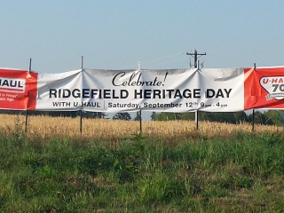 A banner near Ridgefield announcing the celebration of Ridgefield Heritage Day and U-Haul Company's 70th anniversary.