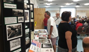 Ridgefield mayor Ron Onslow checks out one of the many U-Haul history displays at the Ridgefield community center.