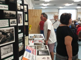 Ridgefield mayor Ron Onslow checks out one of the many U-Haul history displays at the Ridgefield community center.