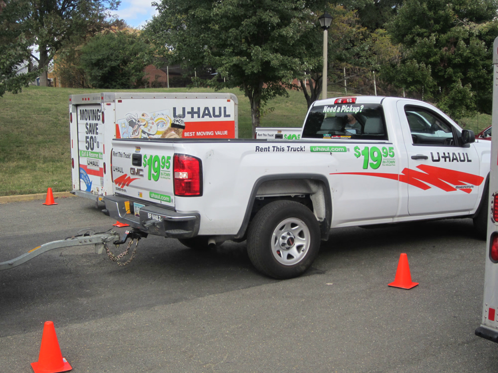Students backing up a U-Haul trailer