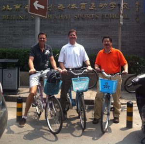 U-Haul scientist Dr. Allan Yang (far right) and Phoenix Mayor Greg Stanton (center) take a bicyling tour of Beijing after the Climate Leaders Summit