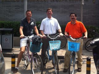 U-Haul scientist Dr. Allan Yang (far right) and Phoenix Mayor Greg Stanton (center) take a bicyling tour of Beijing after the Climate Leaders Summit