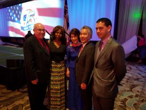 Joe and Silvia Shoen, left, and MCP Kaleo Alau, far right, meet Hawaiian governor David Ige and his wife at the tribute dinner on Dec. 6.