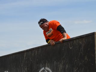 Dave Hellmers climbs Spartan obstacles.