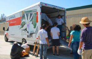 Volunteers Help Load U-Haul Truck