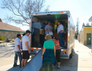 Volunteers Help Load U-Haul Truck