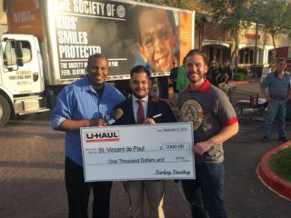 U-Haul donates $1,000 to St. Vincent de Paul during its annual Turkey Tuesday fundraising efforts at Basha's in Gilbert, Ariz.
