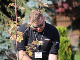 U-Haul Team Member Paul Chalmers planting tree