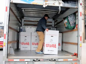 Man in U-Haul truck with TFT boxes