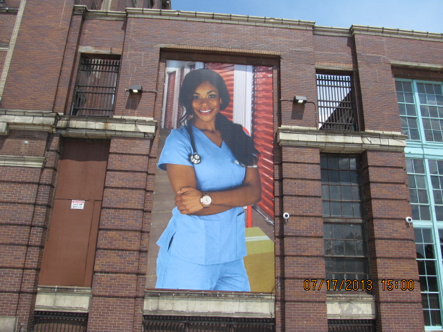 Moving Detroit: There’s a 30′ Woman on Our Building! Really! 08-01-13