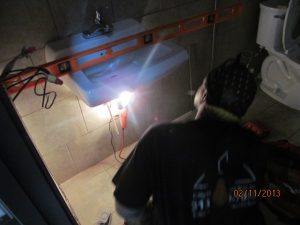 U-Haul Nabisco Building Detroit showroom_bathrooms installing sink
